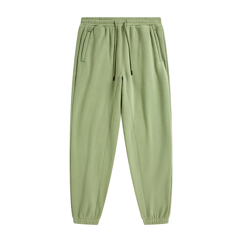 IVN Atelier solid color loose sweatpants showing relaxed fit and soft fabric in a casual indoor setting