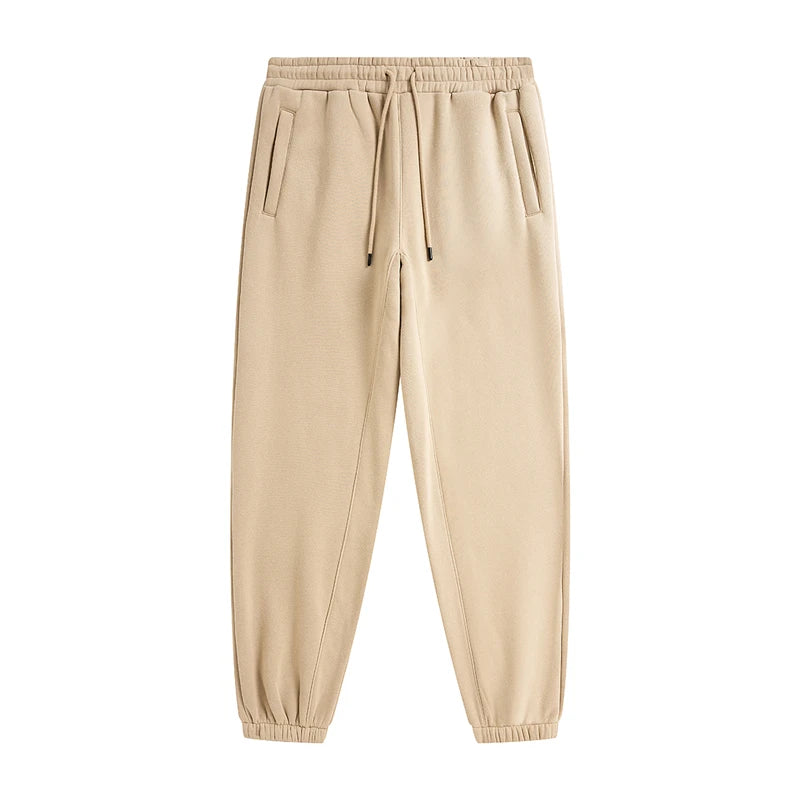 IVN Atelier solid color loose sweatpants, relaxed fit with elastic waistband and cuffs, made from soft comfortable fabric.