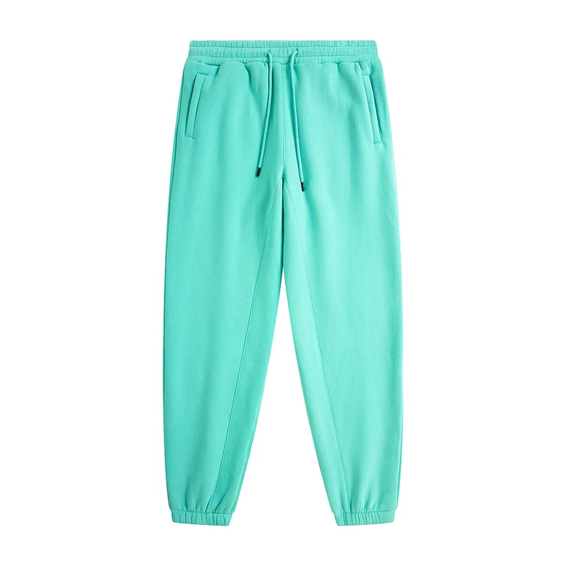 IVN Atelier solid color loose sweatpants displayed on a hanger, highlighting the comfortable, relaxed fit and soft fabric.