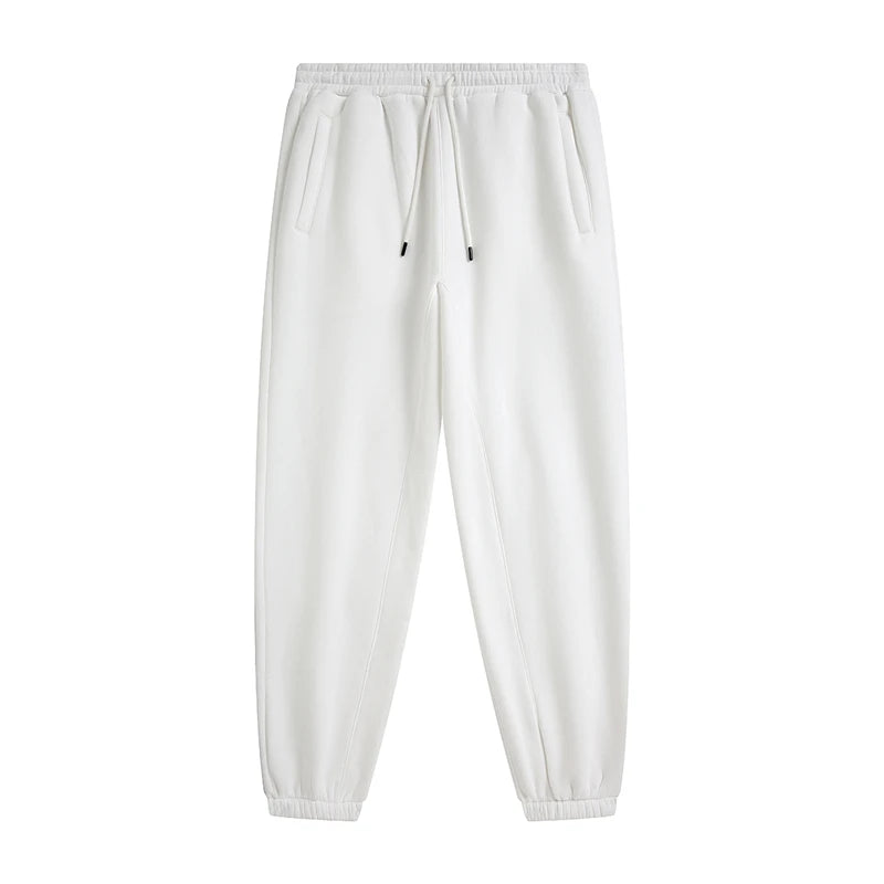 IVN Atelier solid color loose sweatpants shown on a model, featuring a relaxed fit and comfortable fabric for casual wear.