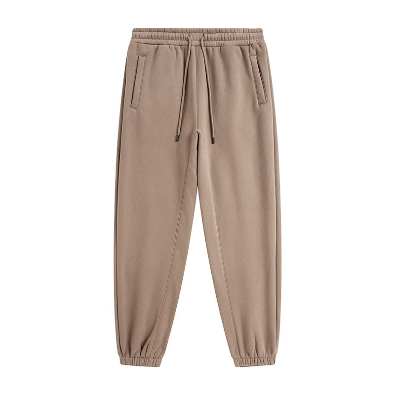 IVN Atelier solid color loose sweatpants shown in high-definition image, featuring a comfortable fit and casual style.