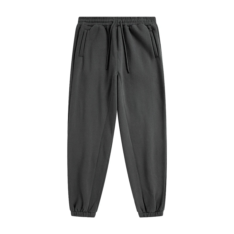 IVN Atelier solid color loose sweatpants shown in a relaxed fit with soft fabric and elastic waistband.