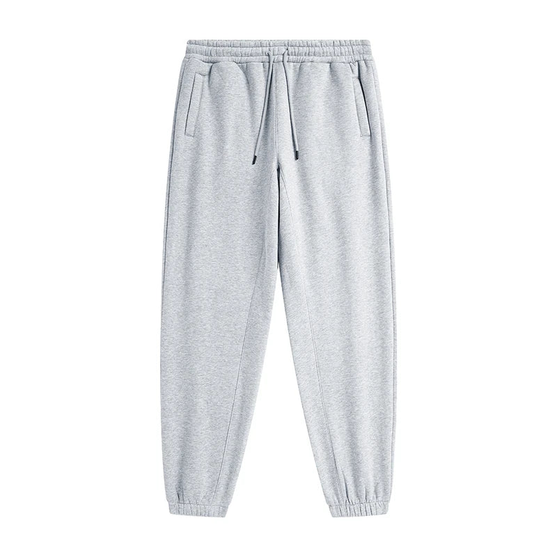 IVN Atelier solid color loose sweatpants shown on model, featuring relaxed fit and comfortable fabric, perfect for casual wear.