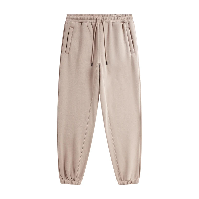 IVN Atelier solid color loose sweatpants showing relaxed fit and soft fabric in a neutral shade