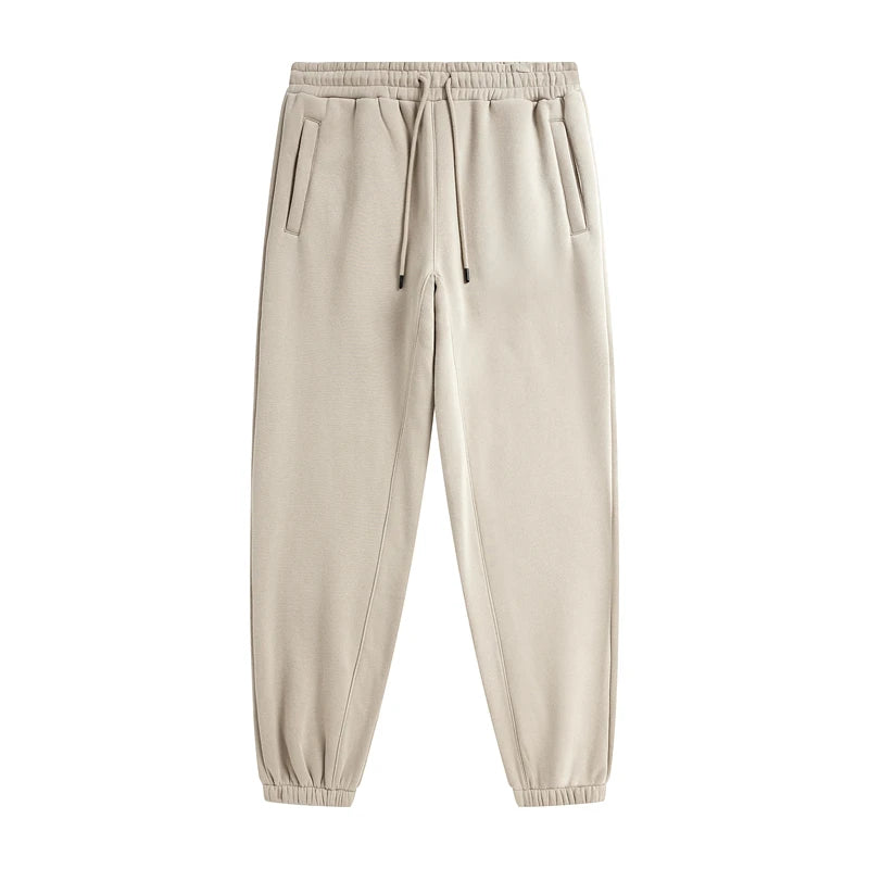 Loose solid color sweatpants by IVN Atelier, featuring a relaxed fit and comfortable fabric, shown in a neutral tone.